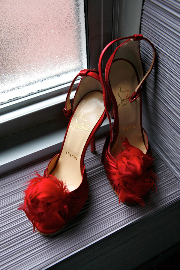 bright red feathered wedding shoes - photo by Merri Cyr